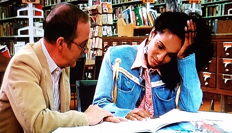 Denise and a reading tutor meet up in the school library in Summer School (1987)